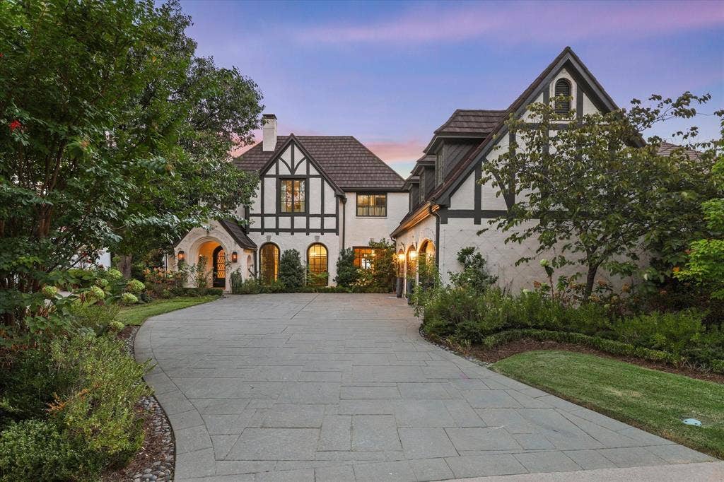 5 SAVANNAH Circle, Frisco, TX 75034 Striking Tudor-inspired architecture framed by mature landscaping and a beautifully private approach.