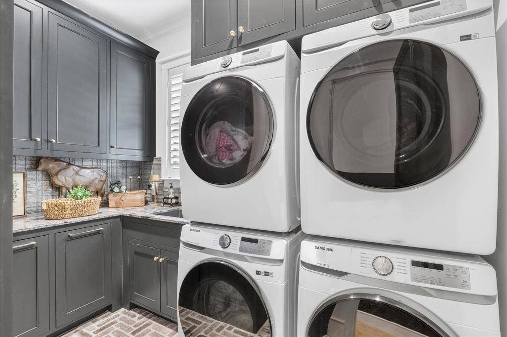 5 SAVANNAH Circle, Frisco, TX 75034 Beautifully finished utility room with extensive cabinetry and space for dual stacked washer and dryer sets.