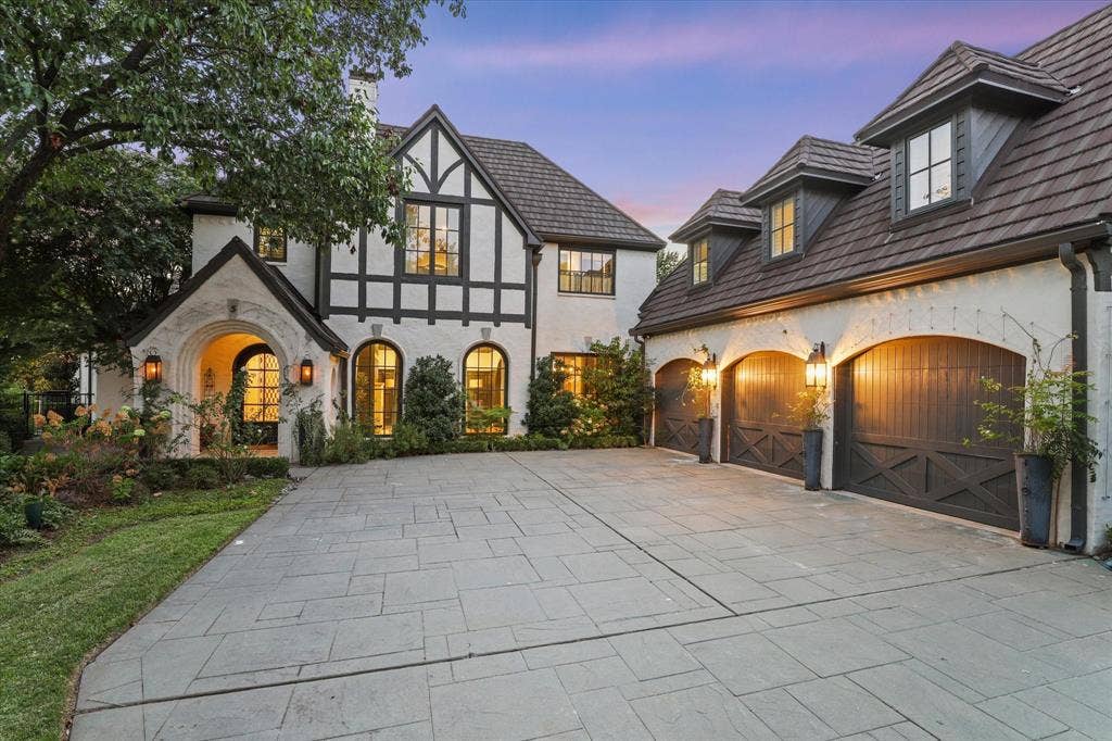 5 SAVANNAH Circle, Frisco, TX 75034 Tudor-inspired architecture takes on a dramatic presence at twilight with warm architectural lighting.