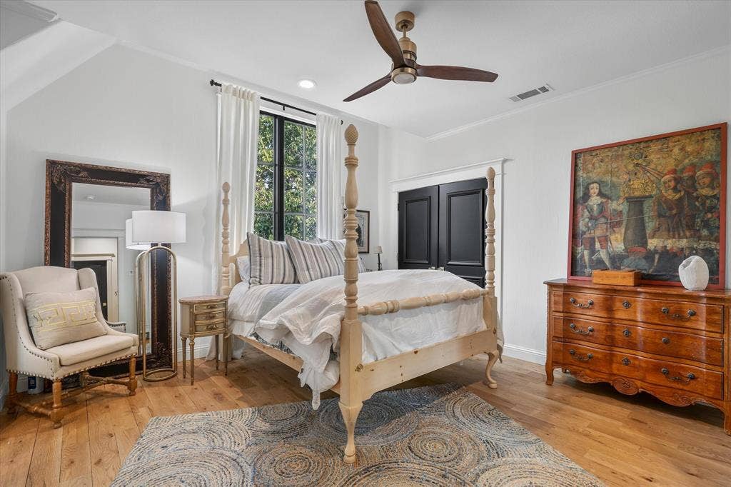 5 SAVANNAH Circle, Frisco, TX 75034 Spacious secondary bedroom with hardwood floors, abundant natural light and room for a comfortable sitting area.