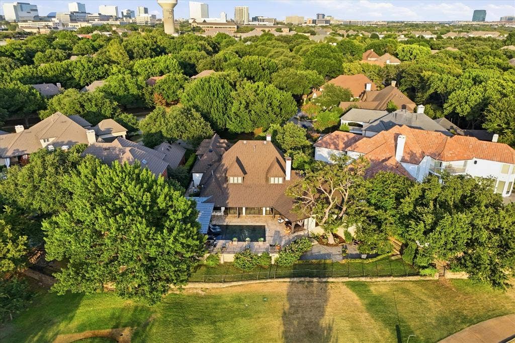 5 SAVANNAH Circle, Frisco, TX 75034 Beautiful rear elevation overlooking the pool and terraces with the golf course just beyond.