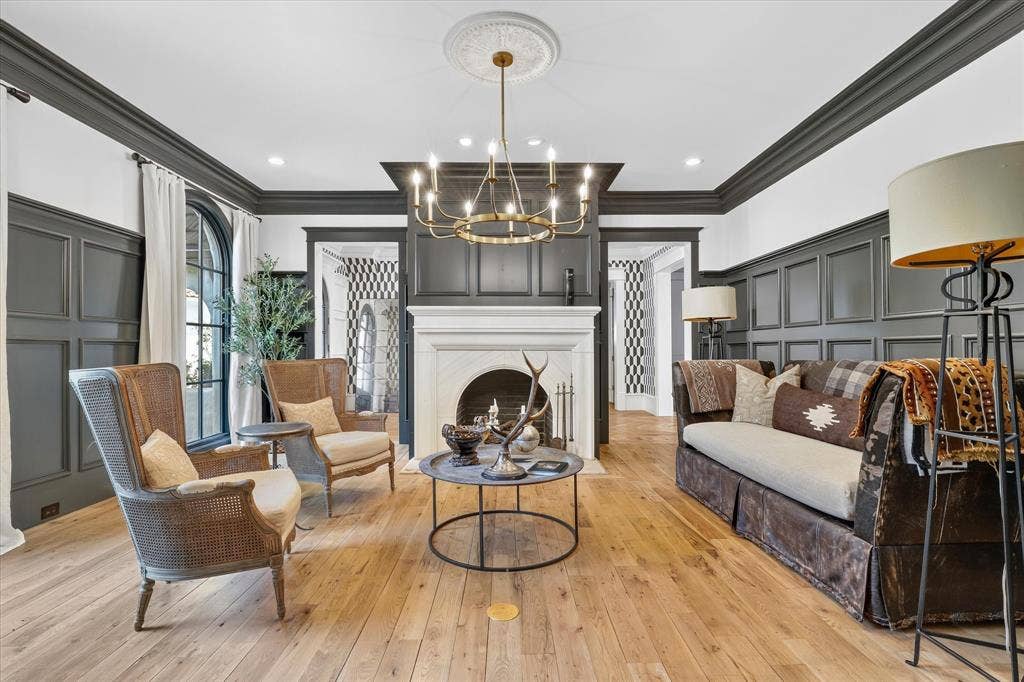 5 SAVANNAH Circle, Frisco, TX 75034 Sophisticated formal living room with fireplace, custom millwork and a beautifully layered designer aesthetic.