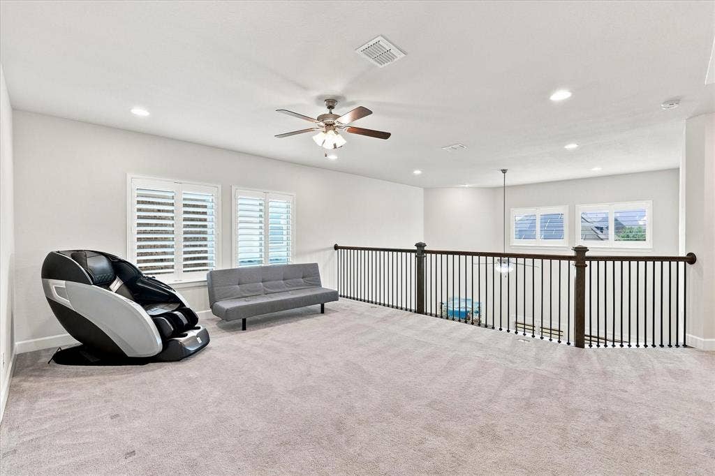 Carpeted room featuring white walls, recessed lighting, and a ceiling fan