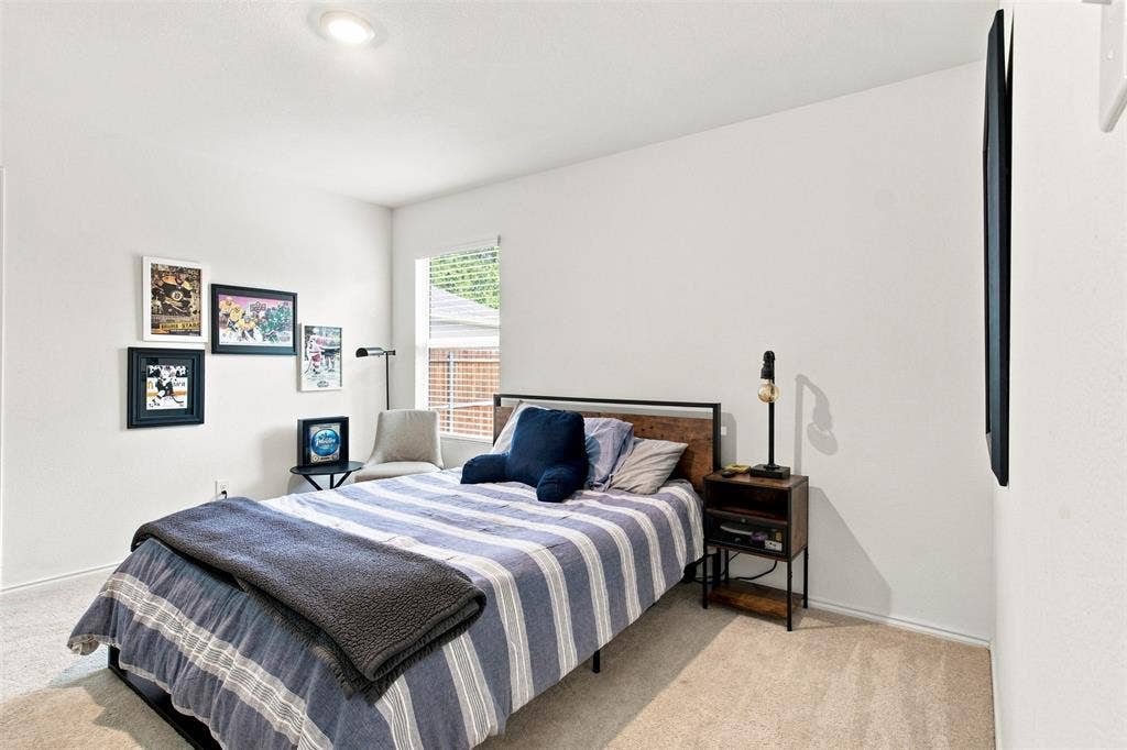 3409 Flicker Lane, McKinney, TX 75071 Recessed ceiling lighting, light-colored carpeting, window with blinds, white wall finishes, and a wall-mounted flat screen
