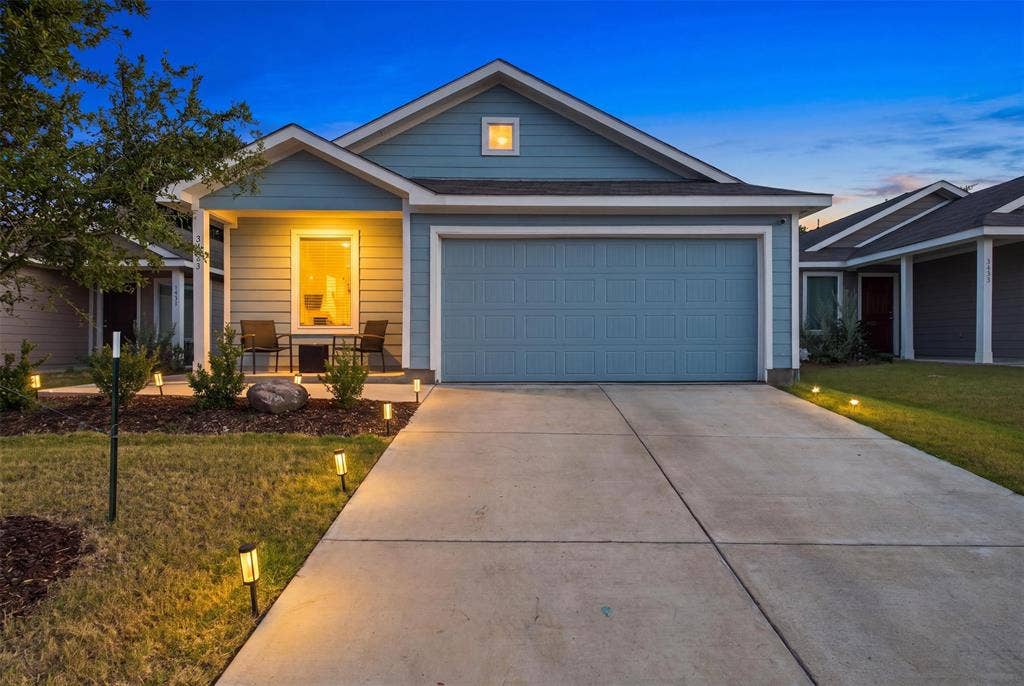 3409 Flicker Lane, McKinney, TX 75071 Light blue siding exterior with white trim