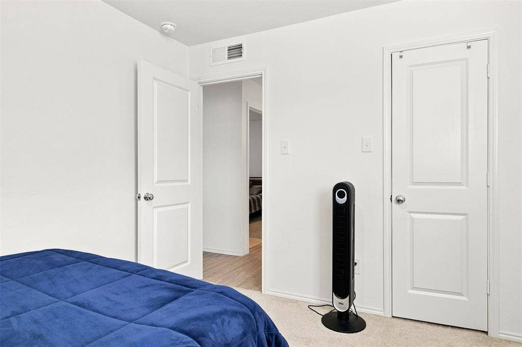 3409 Flicker Lane, McKinney, TX 75071 White interior doors, wall-to-wall carpeting, and a smoke detector