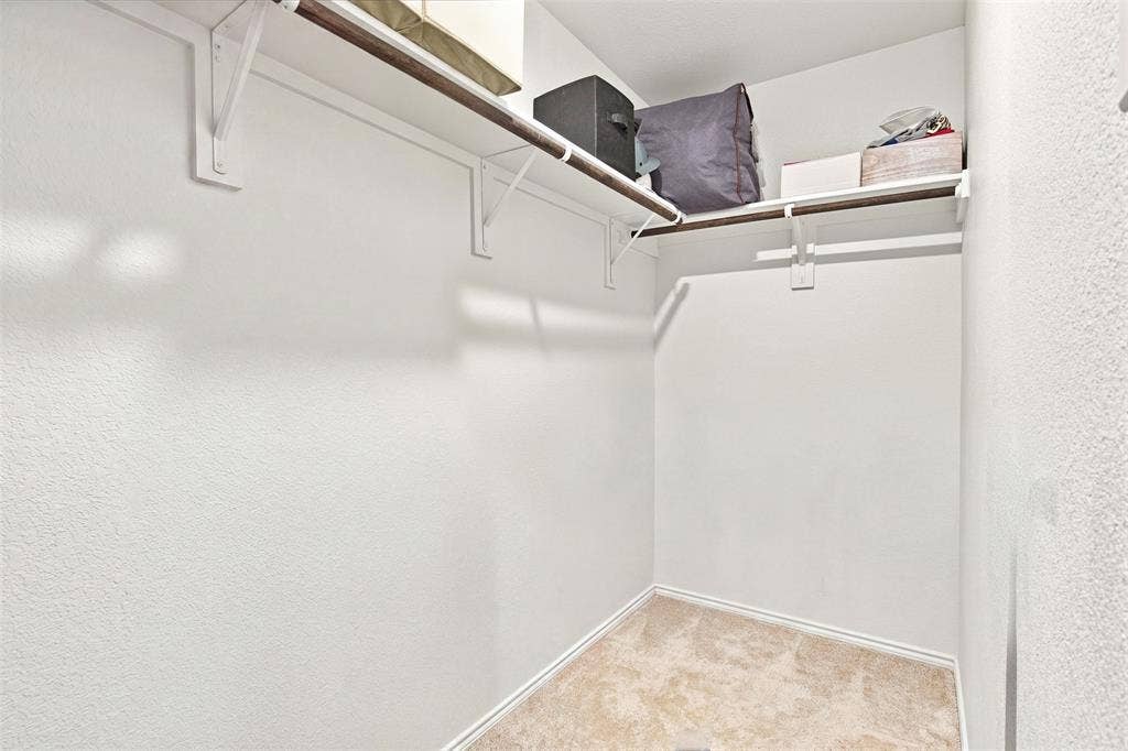 3409 Flicker Lane, McKinney, TX 75071 Built-in shelving and clothing rods