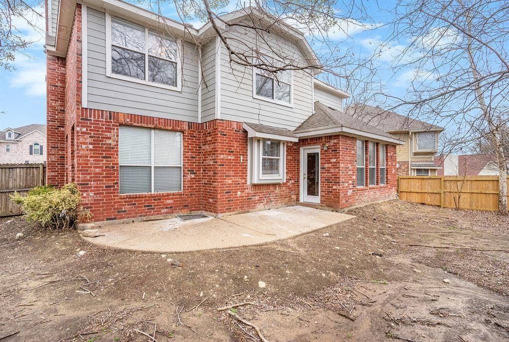 Rear view of property featuring a patio area