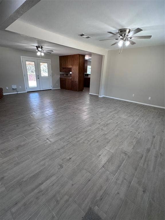 1321 Hurstview Drive, Hurst, TX 76053 Spacious open-concept living area featuring wood-look tile flooring, neutral wall tones, and recessed lighting