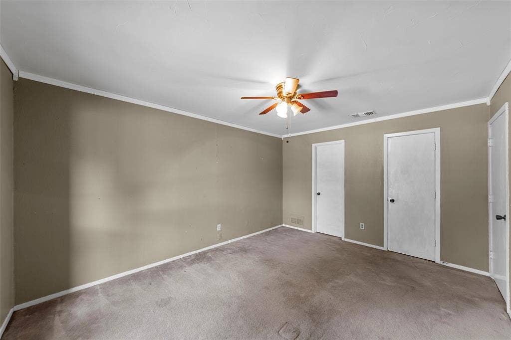 1116 Windsong Trail, Richardson, TX 75081 Neutral wall finish, ceiling fan with light fixture, white trim, and two panel doors