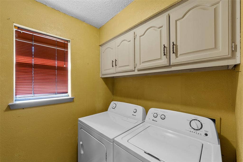 1116 Windsong Trail, Richardson, TX 75081 Dedicated laundry area with upper cabinetry and a window
