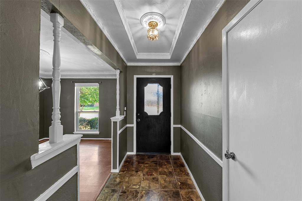 1116 Windsong Trail, Richardson, TX 75081 Foyer with tray ceiling, crown molding, and decorative ceiling medallion