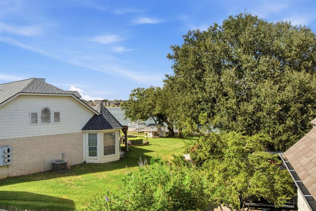 600 N Avalon Court, Granbury, TX 76048 View with mature trees from the upstairs covered balcony looking out onto Lake Granbury