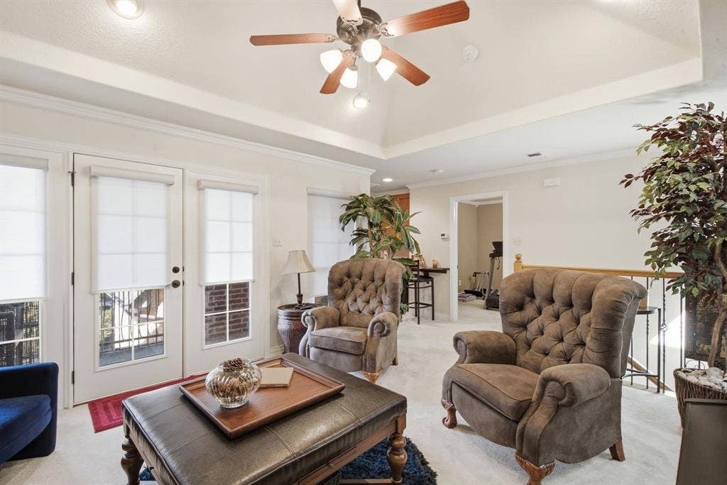 600 N Avalon Court, Granbury, TX 76048 Upstairs living area featuring a central multi-light ceiling fan, recessed lighting, and glass-paned doors that goes onto the upstairs patio overlooking Lake Granbury
