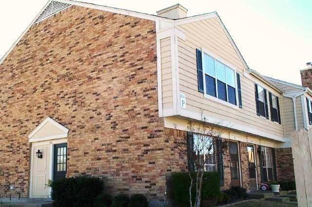 2500 E Park Boulevard, #P2, Plano, TX 75074 Another view of the front of the unit. Brick and siding exterior with gabled roofline and multiple window treatments