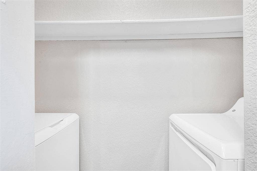 2500 E Park Boulevard, #P2, Plano, TX 75074 utility room with full size washer and dryer