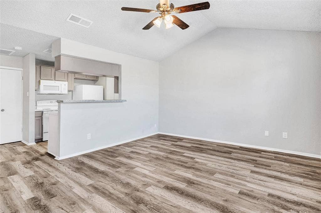 2500 E Park Boulevard, #P2, Plano, TX 75074 Another view of the living room overlooking kitchen area