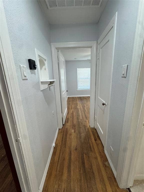 8105 White Settlement Road, White Settlement, TX 76108 Wood-finish flooring throughout, bright white trim, light-colored wall paint, and white paneled doors