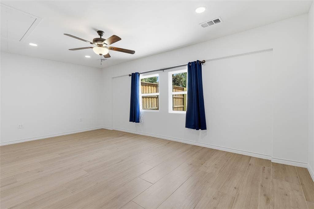 2808 Fountain Head Drive, Plano, TX 75023 Recessed lighting, wood-finish flooring, and a ceiling fan with integrated light