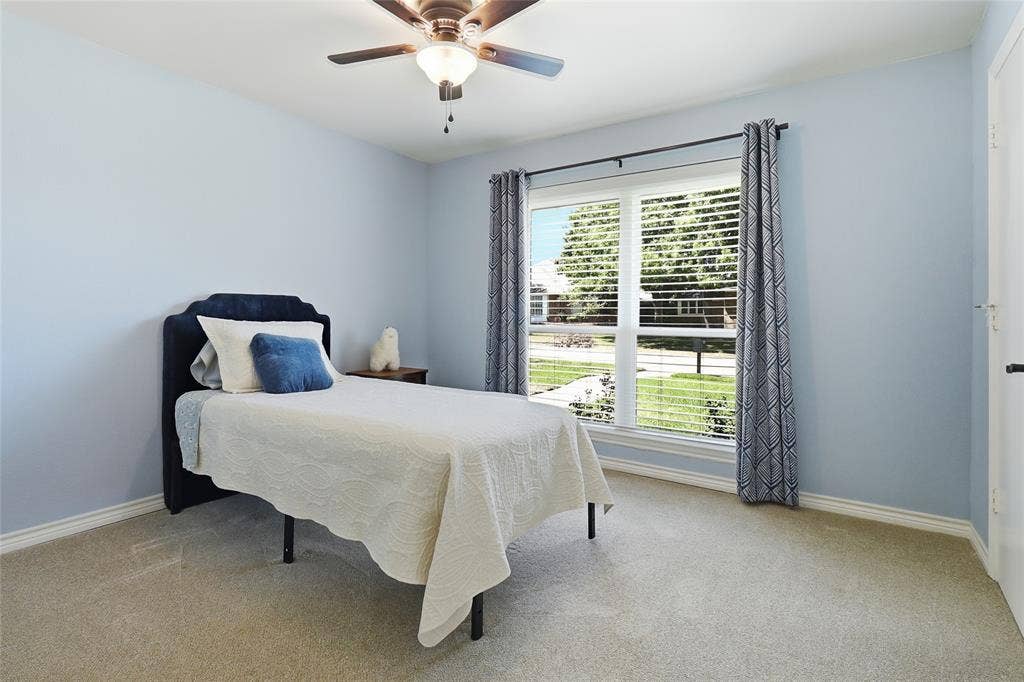 2808 Fountain Head Drive, Plano, TX 75023 Carpeted flooring, a ceiling fan with integrated lighting, window blinds, and a white paneled door