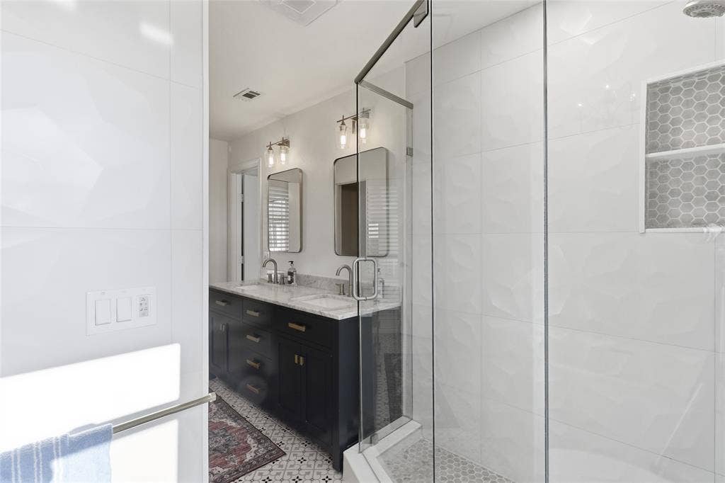 2808 Fountain Head Drive, Plano, TX 75023 Master bathroom with glass enclosed shower with honeycomb tile niche