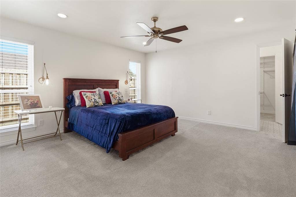 2808 Fountain Head Drive, Plano, TX 75023 Master bedroom with recessed lighting, ceiling fan with light, light-colored carpeting, multiple windows with blinds.