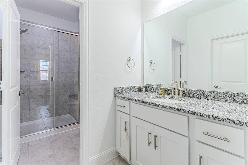 2515 Bedford Road, Northlake, TX 76226 Vanity with stone countertop and undermount sink
