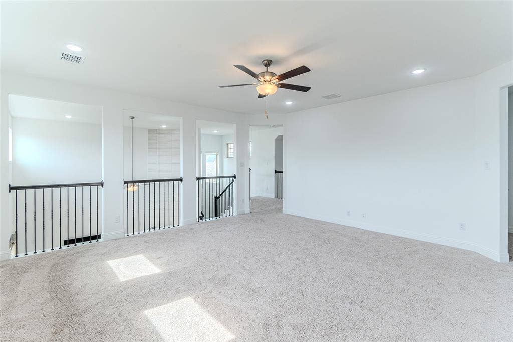 2515 Bedford Road, Northlake, TX 76226 Spacious carpeted area with a ceiling fan and recessed lighting