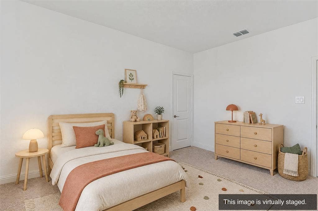 2515 Bedford Road, Northlake, TX 76226 White walls, light-toned wood-finish flooring, and a white door with dark hardware