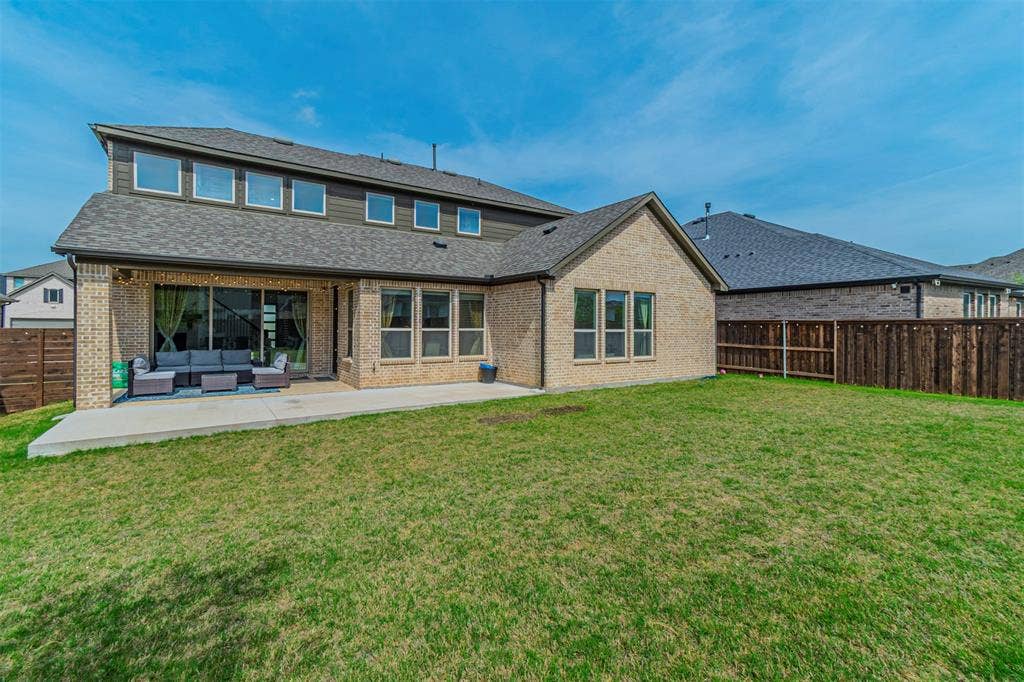 2515 Bedford Road, Northlake, TX 76226 Expansive backyard featuring a manicured lawn, a large concrete patio, and a privacy fence