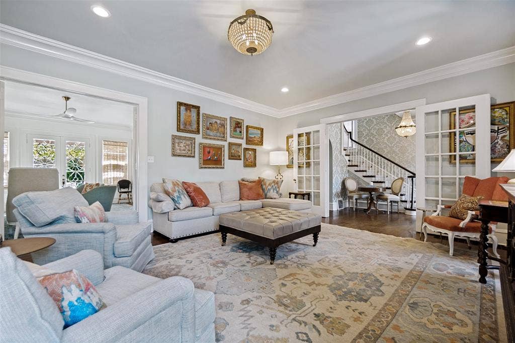 5610 Gaston Avenue, Dallas, TX 75214 Recessed lighting, crown molding, wood-finish flooring, French doors, and a chandelier