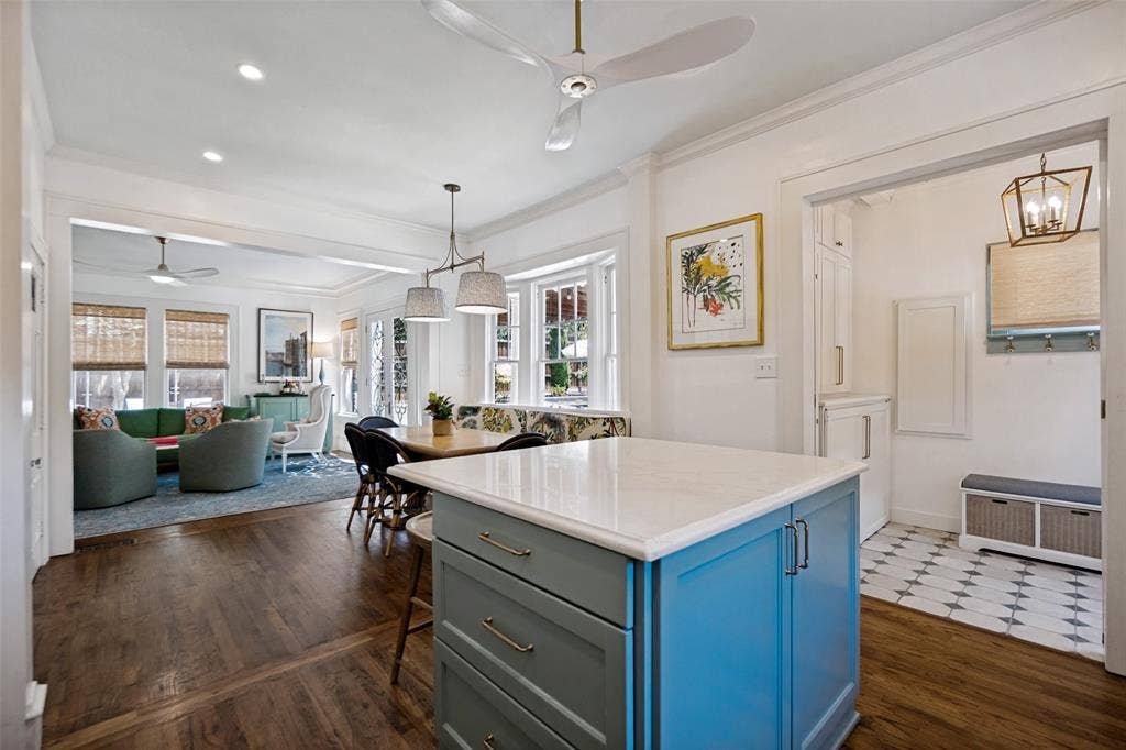 5610 Gaston Avenue, Dallas, TX 75214 Kitchen island with a light-colored countertop and painted cabinetry