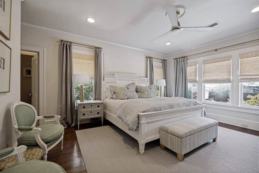 5610 Gaston Avenue, Dallas, TX 75214 Recessed ceiling lighting, a modern ceiling fan, wood-finish flooring, and multiple windows with window treatments