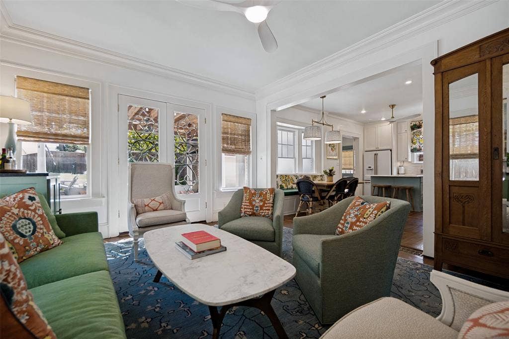 5610 Gaston Avenue, Dallas, TX 75214 Living space with crown molding, double French doors, wood-finish flooring, and recessed lighting