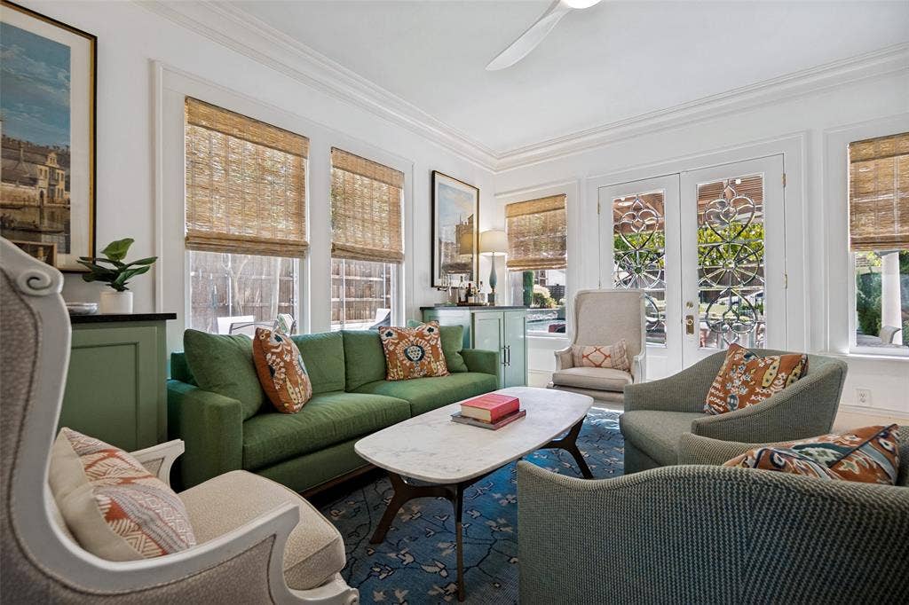 5610 Gaston Avenue, Dallas, TX 75214 White crown molding, multiple large windows, French doors with decorative glass, recessed lighting, and a ceiling fan