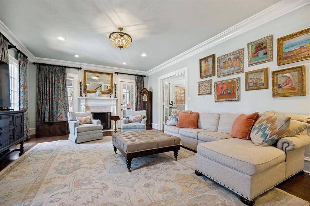 5610 Gaston Avenue, Dallas, TX 75214 Crown molding details, recessed lighting, and a decorative chandelier illuminate this room