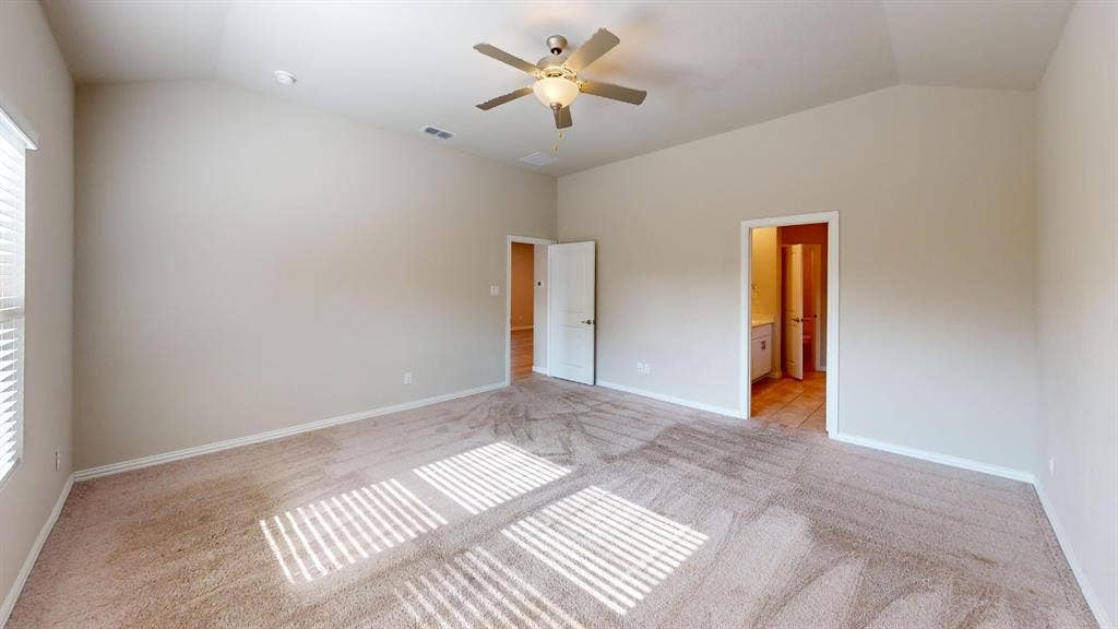 1508 Lannon Lane, Melissa, TX 75454 Vaulted ceiling, ceiling fan with integrated lighting, window with blinds, light-colored carpeting, and a white interior door