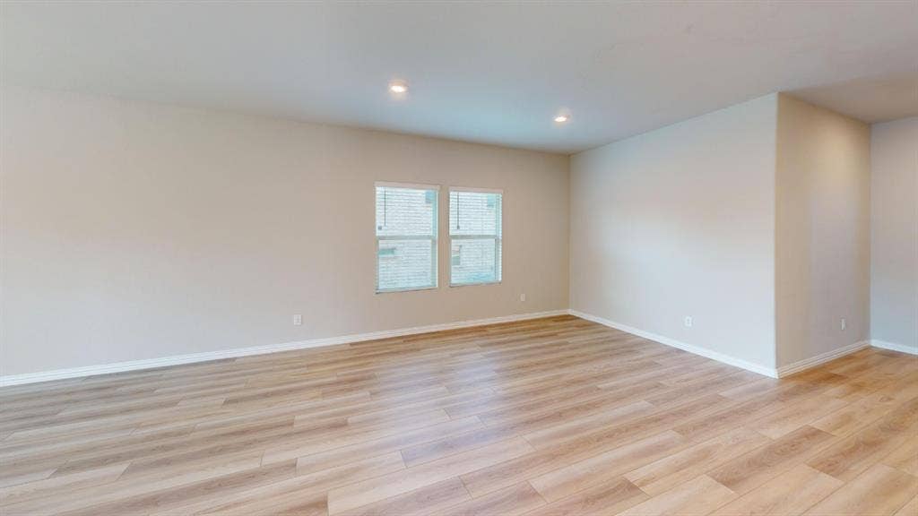 1508 Lannon Lane, Melissa, TX 75454 Expansive room featuring wood-finish flooring, recessed lighting, and multiple windows