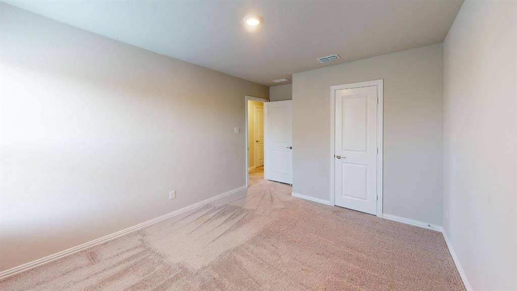 1508 Lannon Lane, Melissa, TX 75454 Neutral wall paint, light brown carpeting, white paneled doors, and recessed lighting