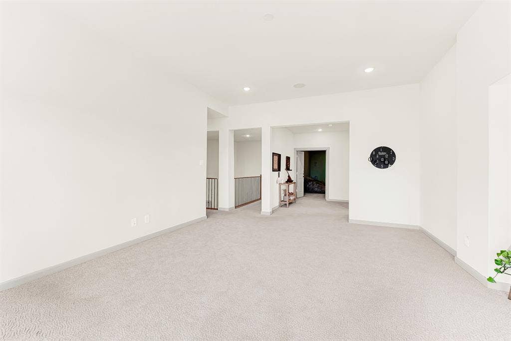 10067 Clover Forest Court, Frisco, TX 75035 Clean, crisp walls and open passageways create an effortless connection to the rest of the upper level. It is the perfect spot for family game nights that casually spill out into adjacent spaces.