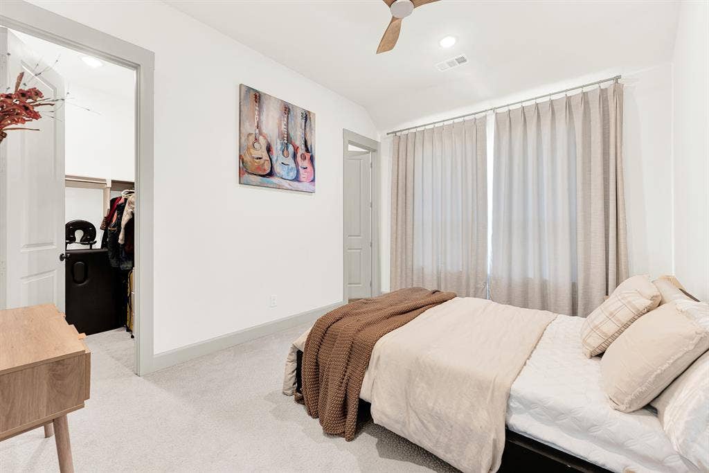 10067 Clover Forest Court, Frisco, TX 75035 Expansive windows flood the space with gentle natural light, accentuating the crisp, clean trim and airy high ceiling structure. Guests can sleep in total peacefulness, waking up refreshed to a slow, sunlit morning right on the main level.