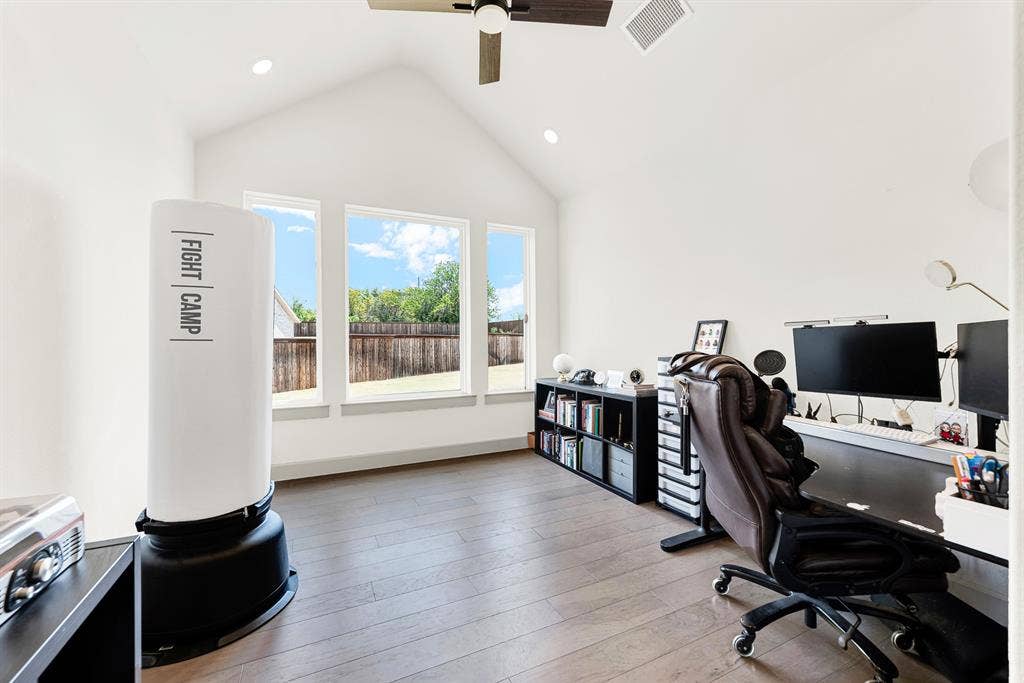 10067 Clover Forest Court, Frisco, TX 75035 A high pitched ceiling paired with a triad of tall back windows bathes the space in bright daytime light. It’s an inspiring sanctuary to tackle focused creative projects or host video calls undisturbed.