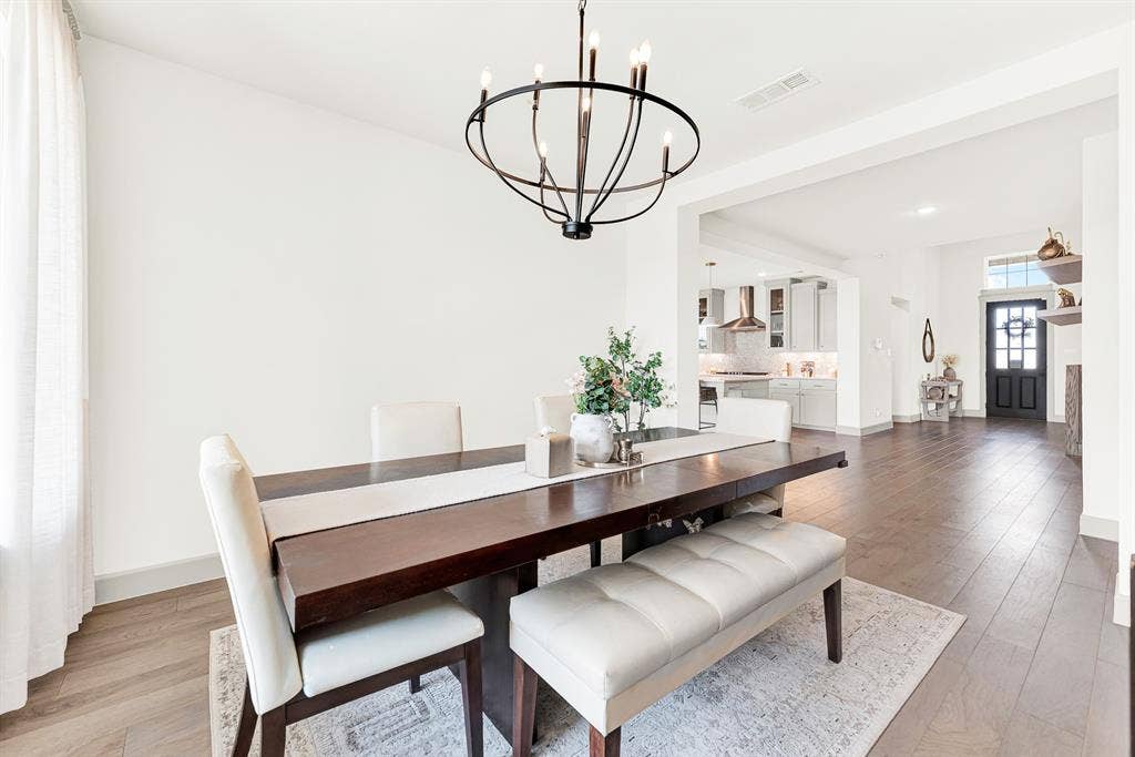 10067 Clover Forest Court, Frisco, TX 75035 A wide cased doorway creates an effortless layout, linking the dining space directly to neighboring home hubs. Imagine enjoying celebratory family birthday toasts while easily serving fresh dishes from nearby counters.