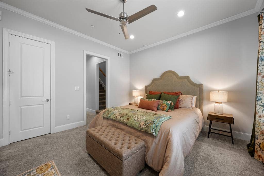 Recessed lighting, crown molding, and a ceiling fan