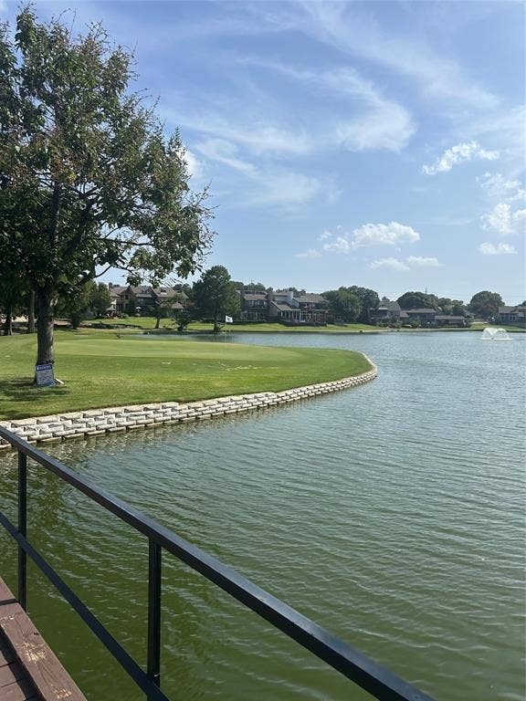 2601 Country Place, Carrollton, TX 75006 Lakefront property with a lush golf course, stone-retained shoreline, and a water feature