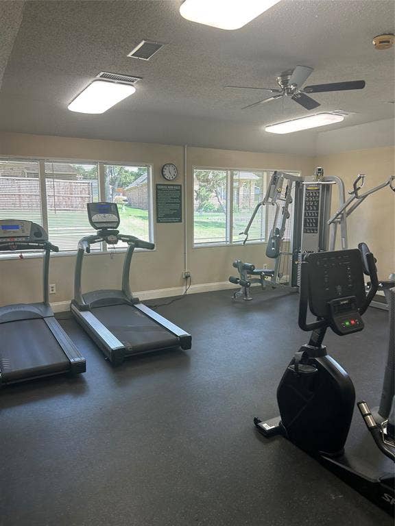 2601 Country Place, Carrollton, TX 75006 Dedicated community fitness room featuring multiple treadmills, stationary bike, and strength training equipment