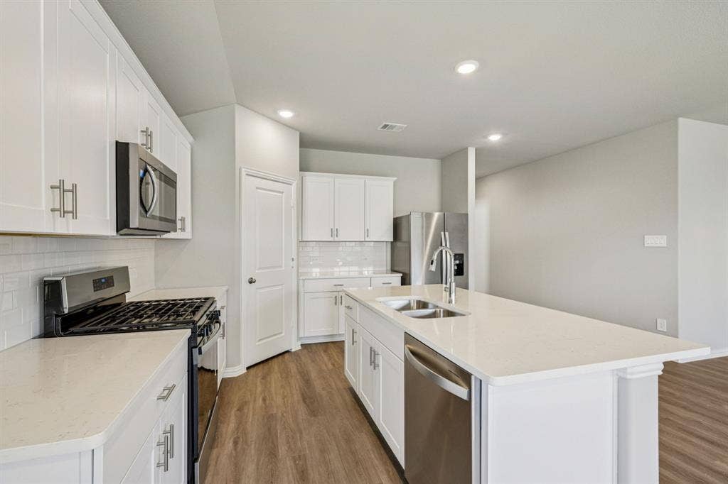 2125 Longchamp Lane, Seagoville, TX 75159 Photo is not of the actual home, but is an inspirational photo of builder’s model home and may depict options, furnishings, and/or decorator features that are not included.