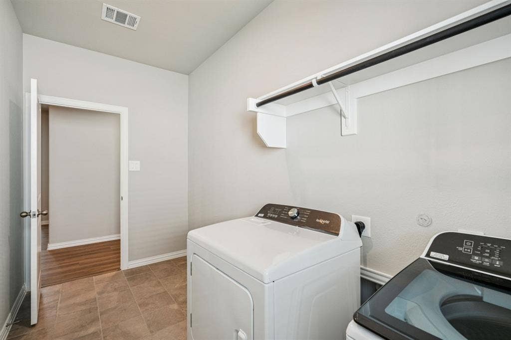 2125 Longchamp Lane, Seagoville, TX 75159 Photo is not of the actual home, but is an inspirational photo of builder’s model home and may depict options, furnishings, and/or decorator features that are not included.