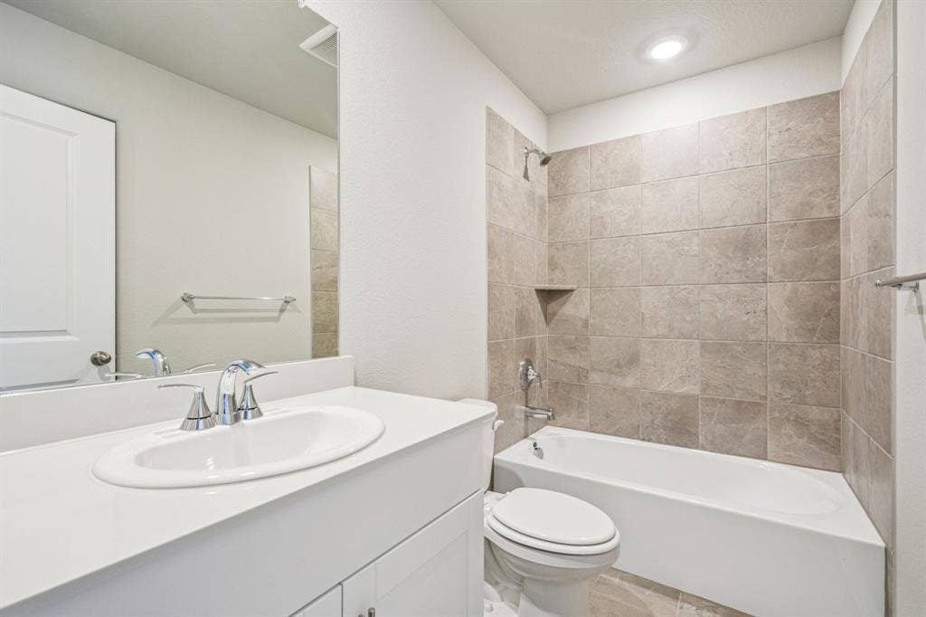 2125 Longchamp Lane, Seagoville, TX 75159 Photo is not of the actual home, but is an inspirational photo of builder’s model home and may depict options, furnishings, and/or decorator features that are not included.