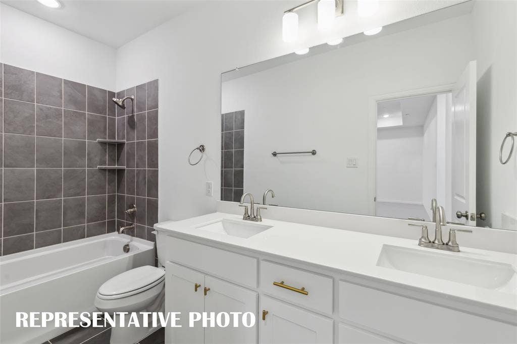 1032 Splitrock Drive, Allen, TX 75013 Friends and family will appreciate having their own vanity space in this thoughtfully designed guest bath.